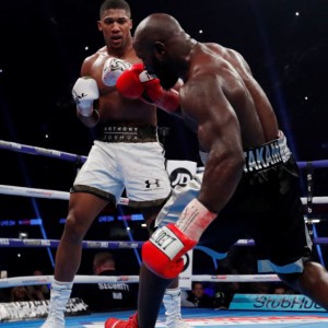 Boxing - Anthony Joshua vs Carlos Takam - IBF & WBA World Heavyweight Titles - Principality Stadium, Cardiff, Britain - October 28, 2017 Anthony Joshua knocks down Carlos Takam Action Images via Reuters/Andrew Couldridge - RC112A813DC0